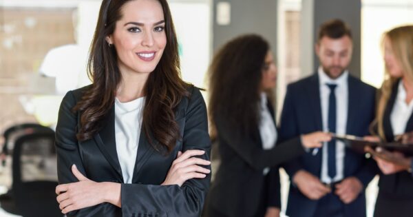 Businesswoman leader in modern office with businesspeople workin